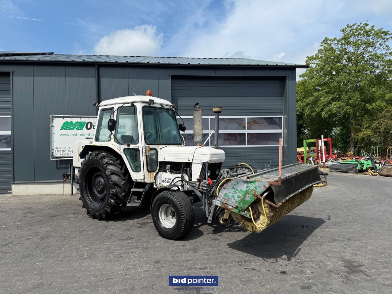 Ford 6610 met rolbezem