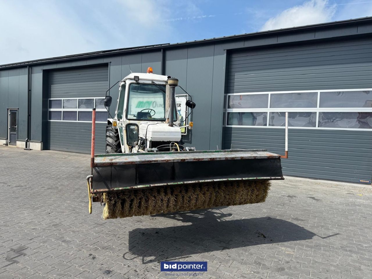 Ford 6610 met rolbezem