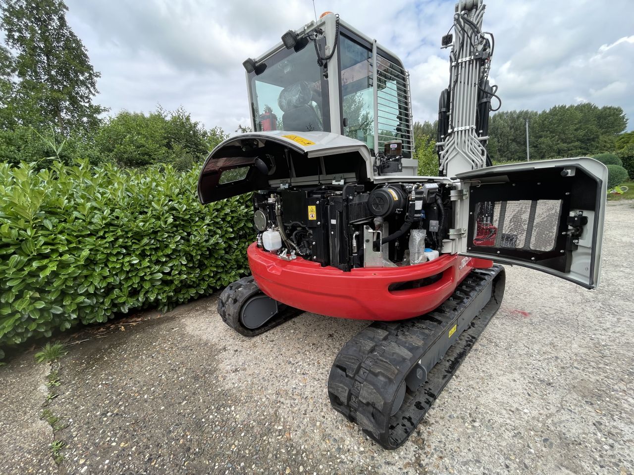 Takeuchi TB257FR met RototiltR2 gripper en autosmering 2023