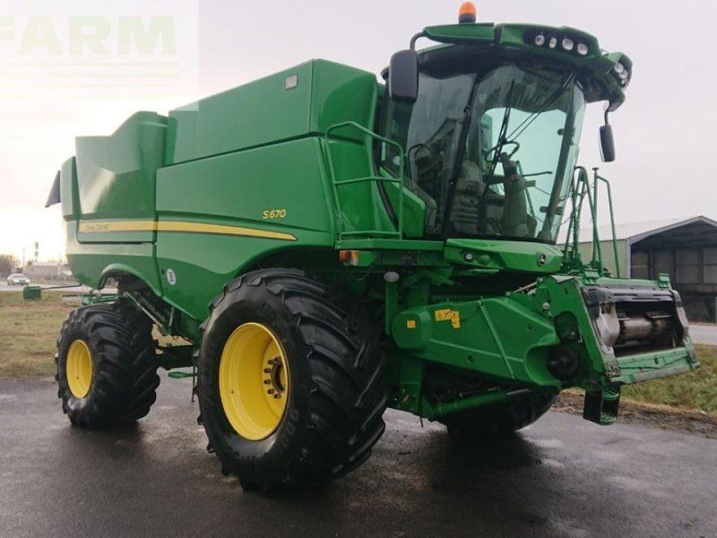 John Deere s670 4wd + macdon fd75