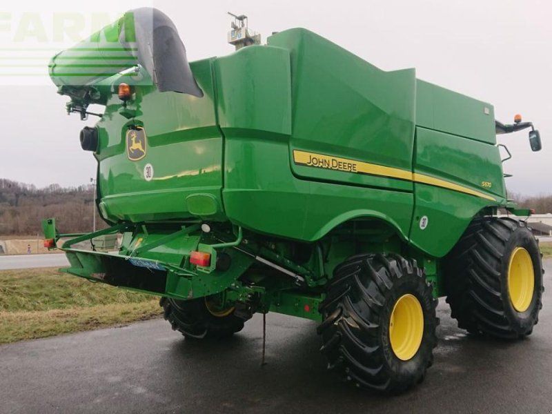 John Deere s670 4wd + macdon fd75
