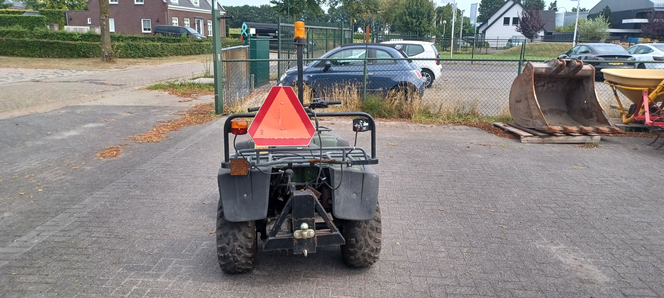 Kawasaki quad met onkruitbrander