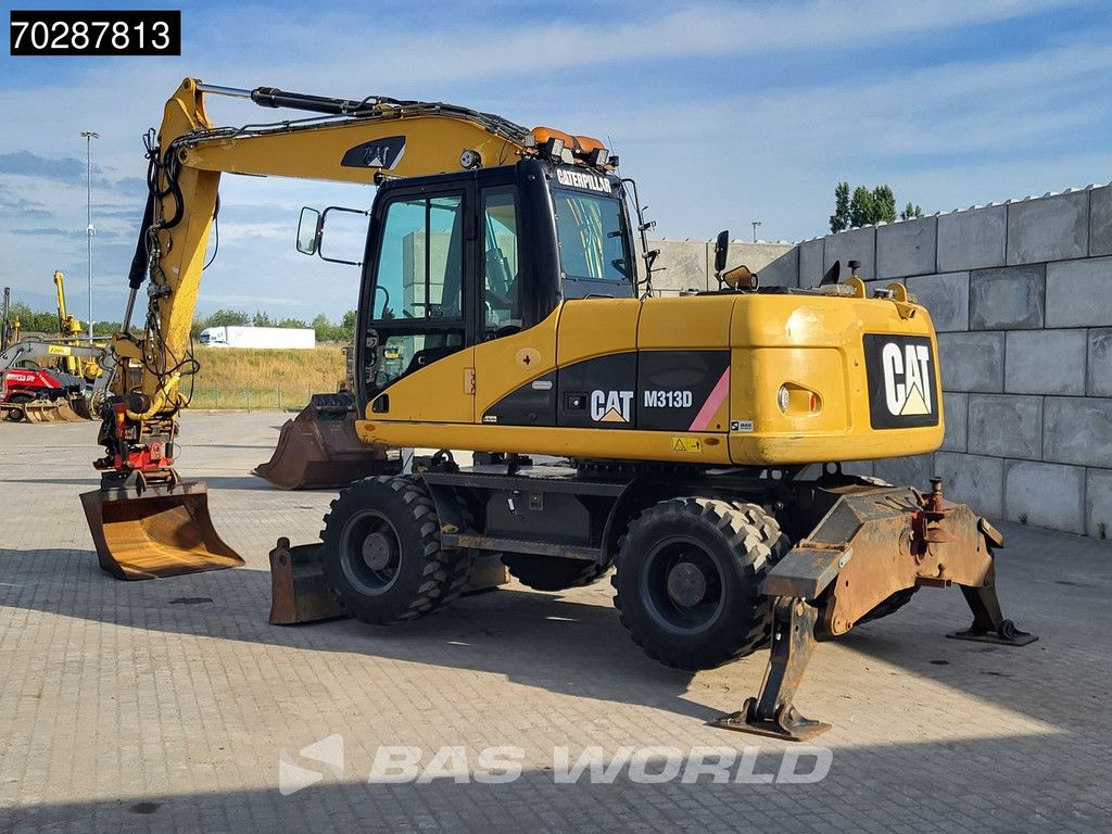 Caterpillar M313 D OUTRIGGERS + BLADE