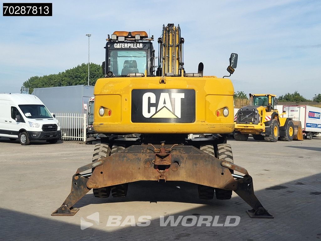 Caterpillar M313 D OUTRIGGERS + BLADE