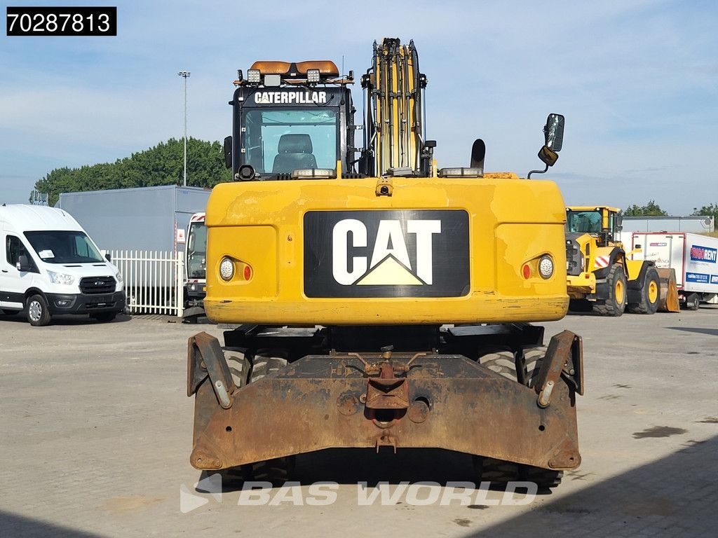 Caterpillar M313 D OUTRIGGERS + BLADE