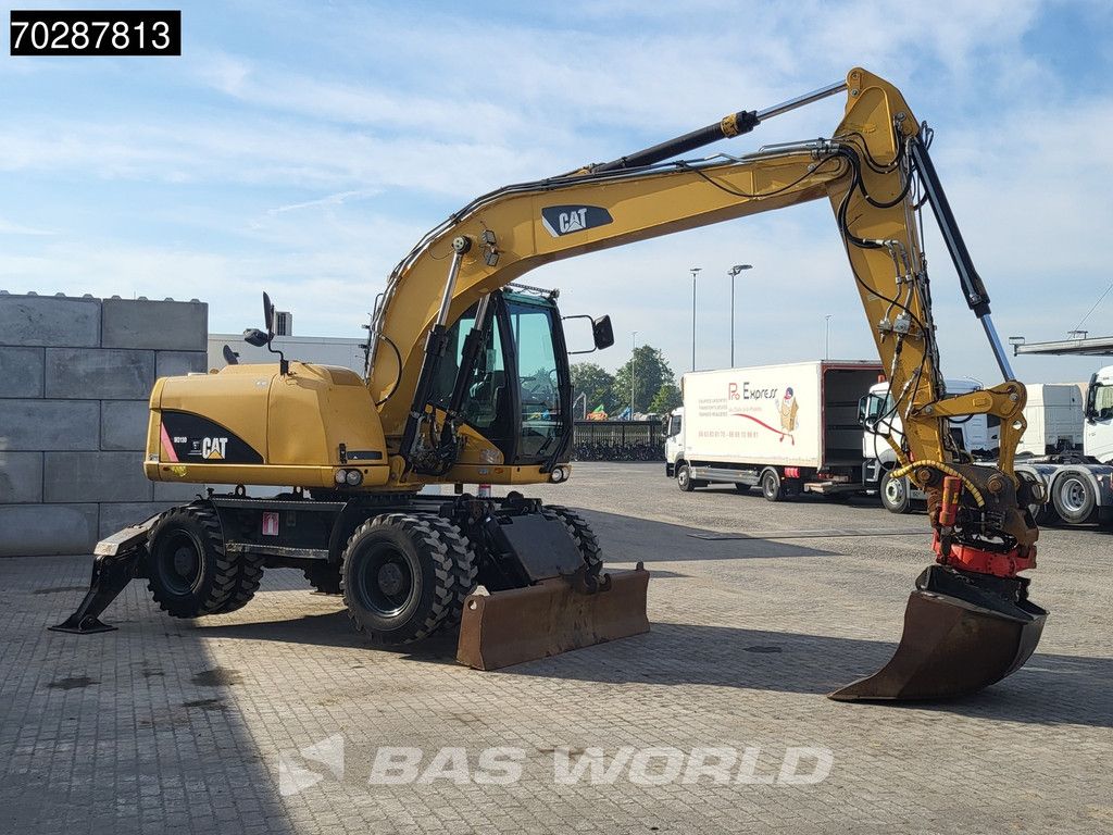 Caterpillar M313 D OUTRIGGERS + BLADE
