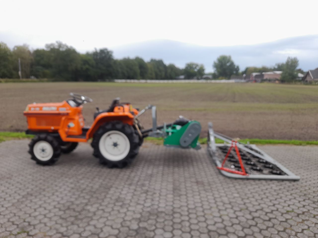 Kubota Bulltra B1-15 minitractor met maaier en weidesleep