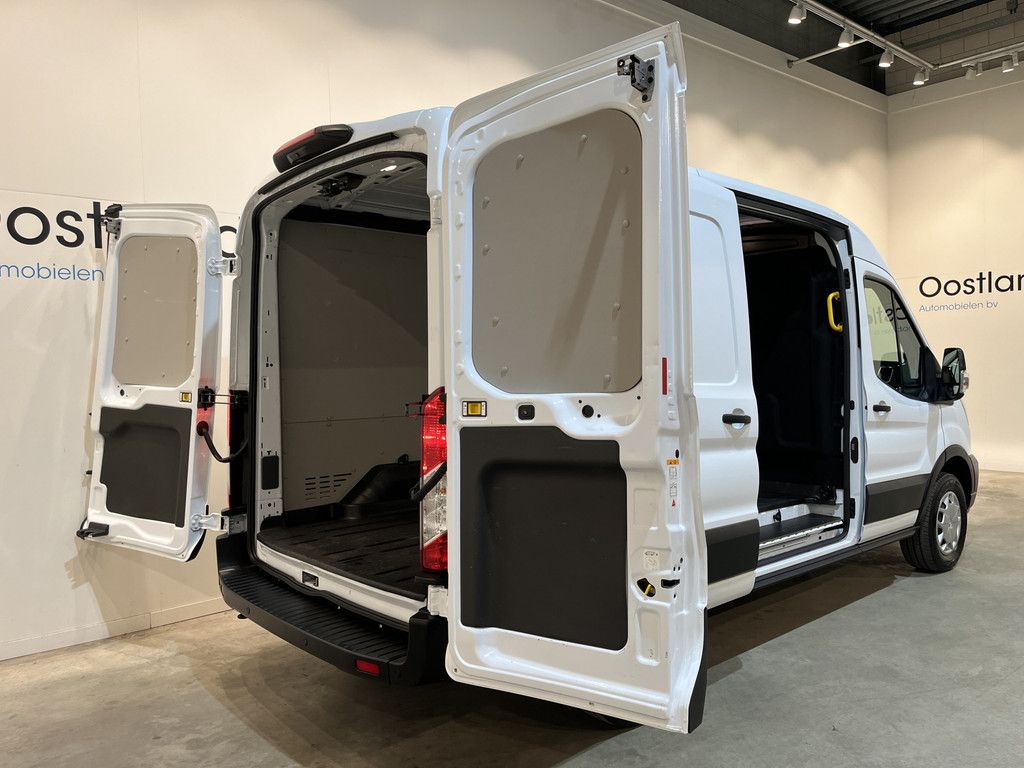Ford E-Transit L2H2 Trend 68 kWh 184 PK / 100% Elektrisch !! / Airco / Cruise Control / CarPlay / Camera / Navigatie / 3-Zits / 15.500 KM !!