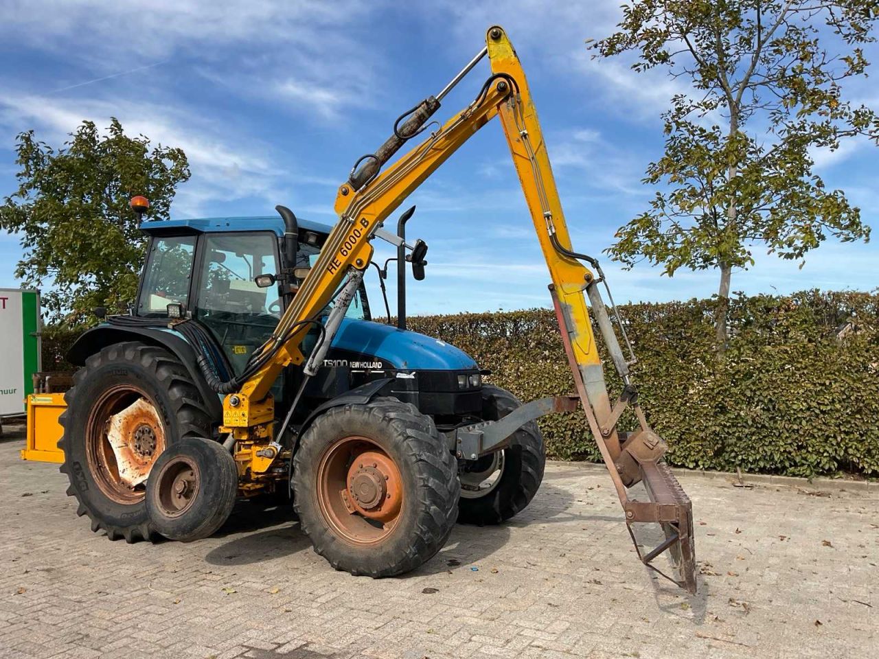 New Holland TS 100 + bos slootarm