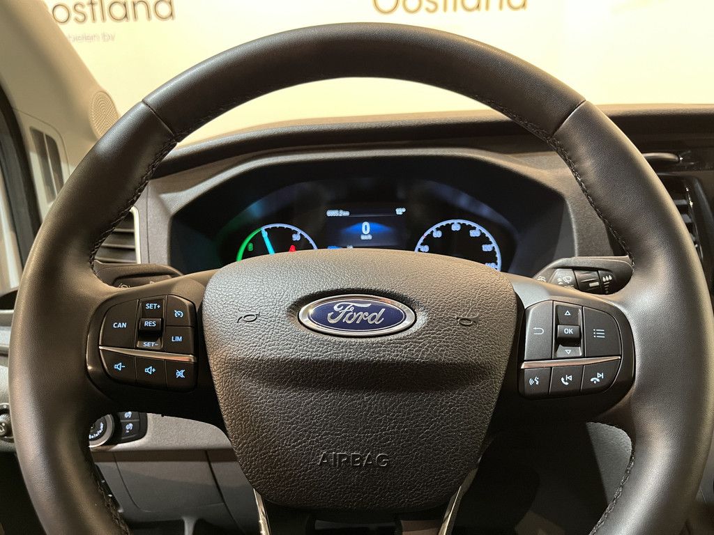 Ford E-Transit L2H2 Trend 68 kWh 184 PK / 100% Elektrisch !! / Airco / Cruise Control / CarPlay / Camera / Navigatie / 3-Zits / 11.750 KM !!
