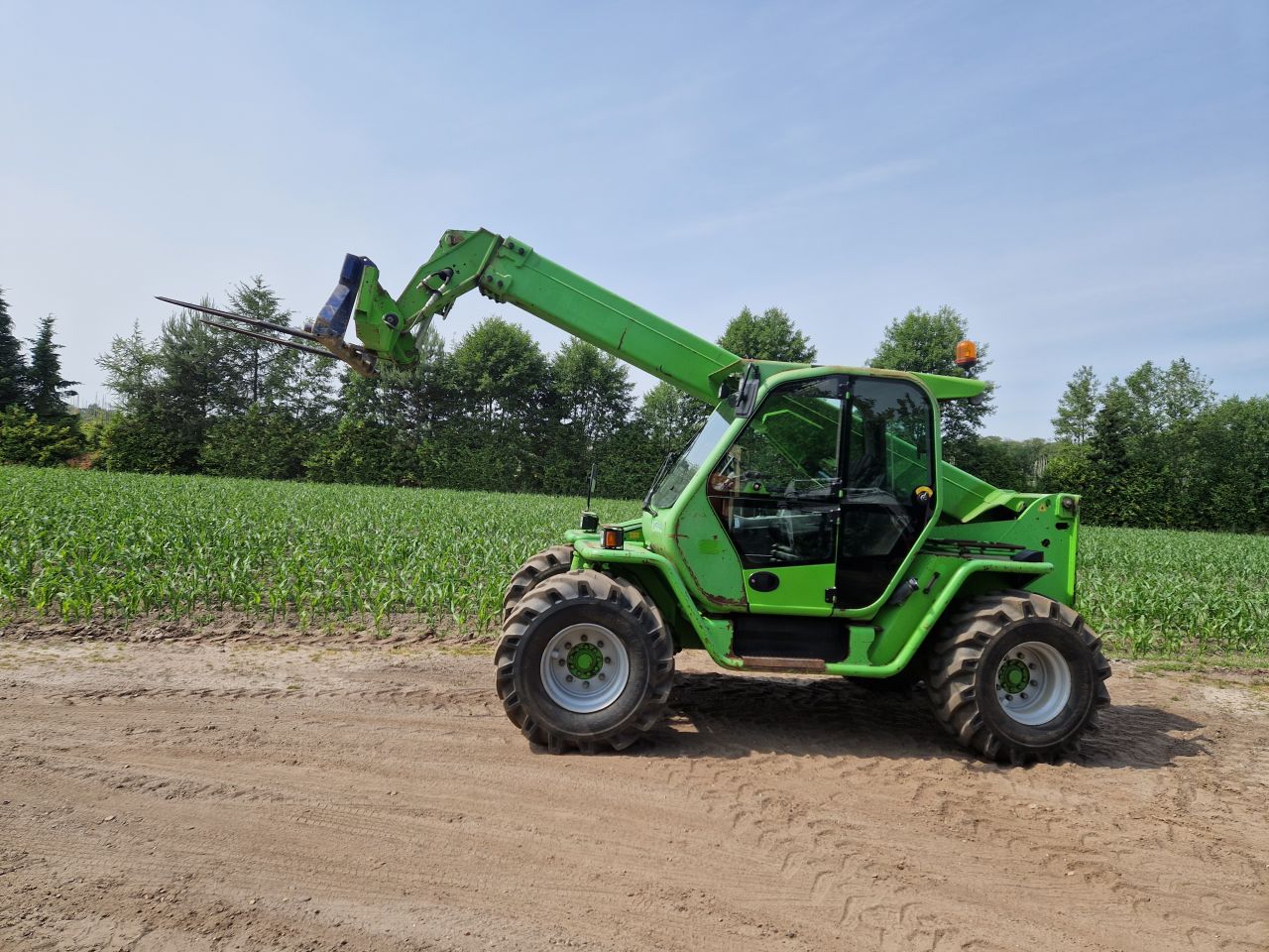 Verreiker merlo telescoop lader 4x4 manitou