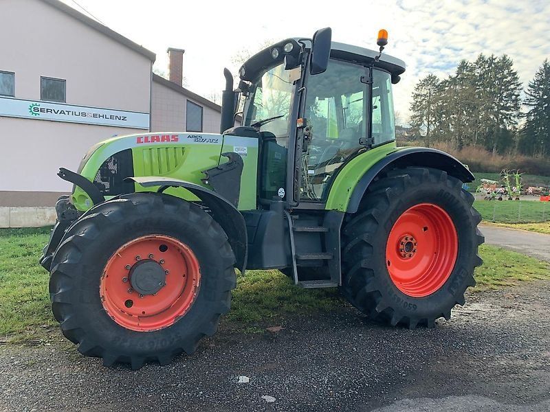 Claas ARES 697 ATZ mit Fronthydraulik und Frontladerkonsolen Stoll