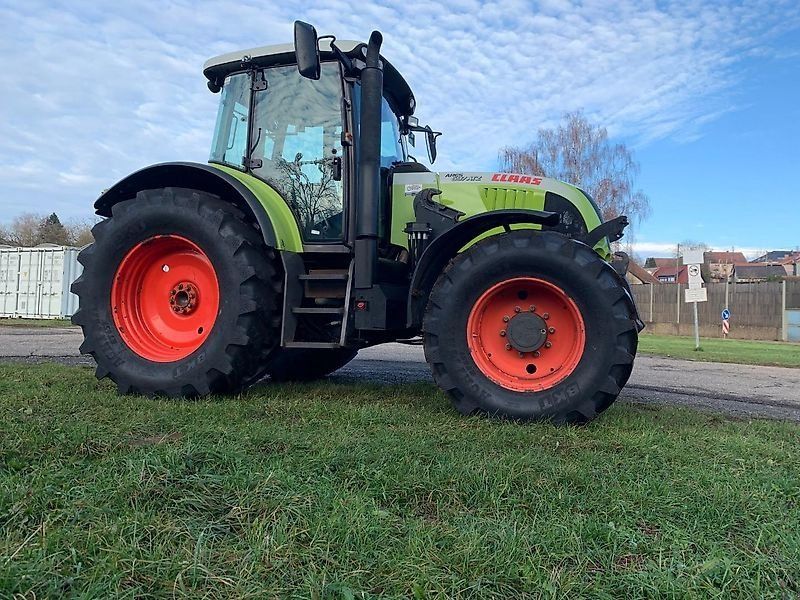 Claas ARES 697 ATZ mit Fronthydraulik und Frontladerkonsolen Stoll