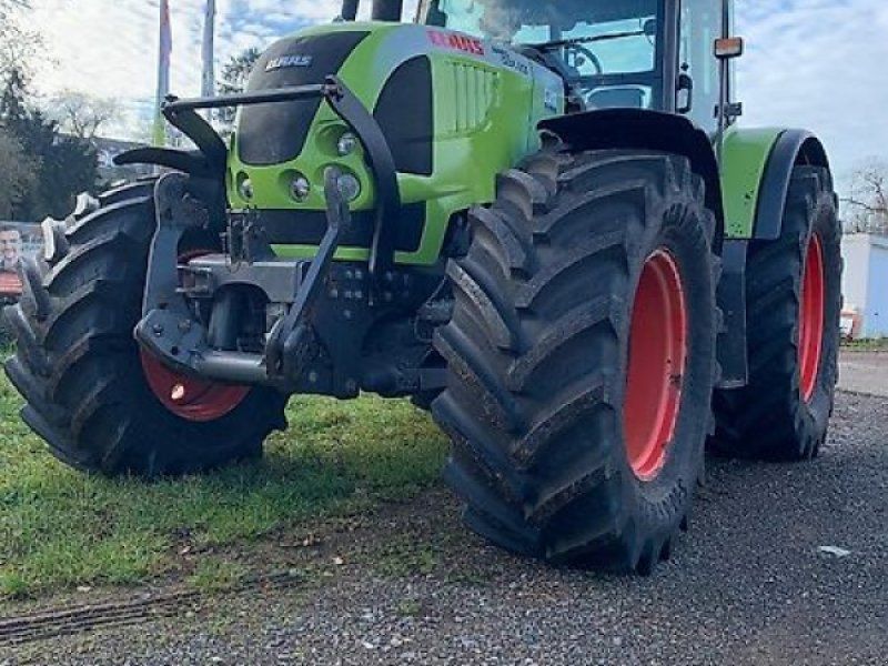 Claas ARES 697 ATZ mit Fronthydraulik und Frontladerkonsolen Stoll