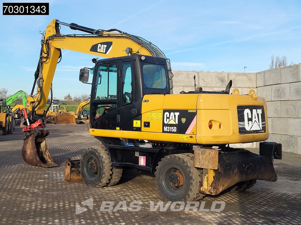 Caterpillar M315 D OUTRIGGERS + BLADE