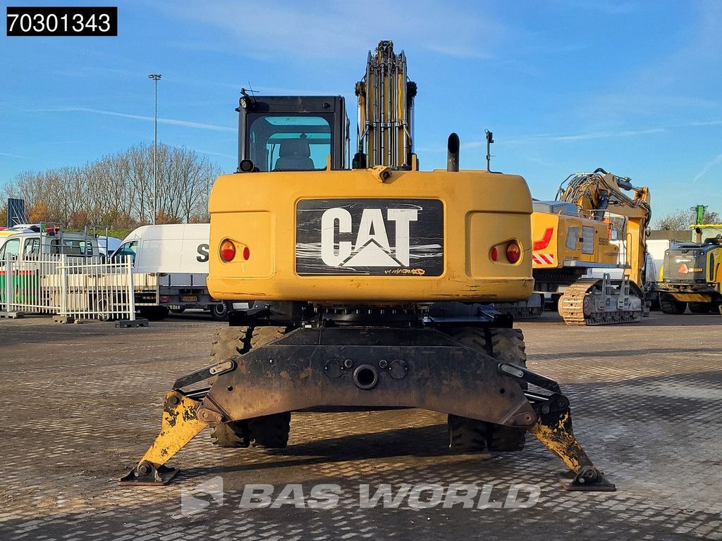 Caterpillar M315 D OUTRIGGERS + BLADE
