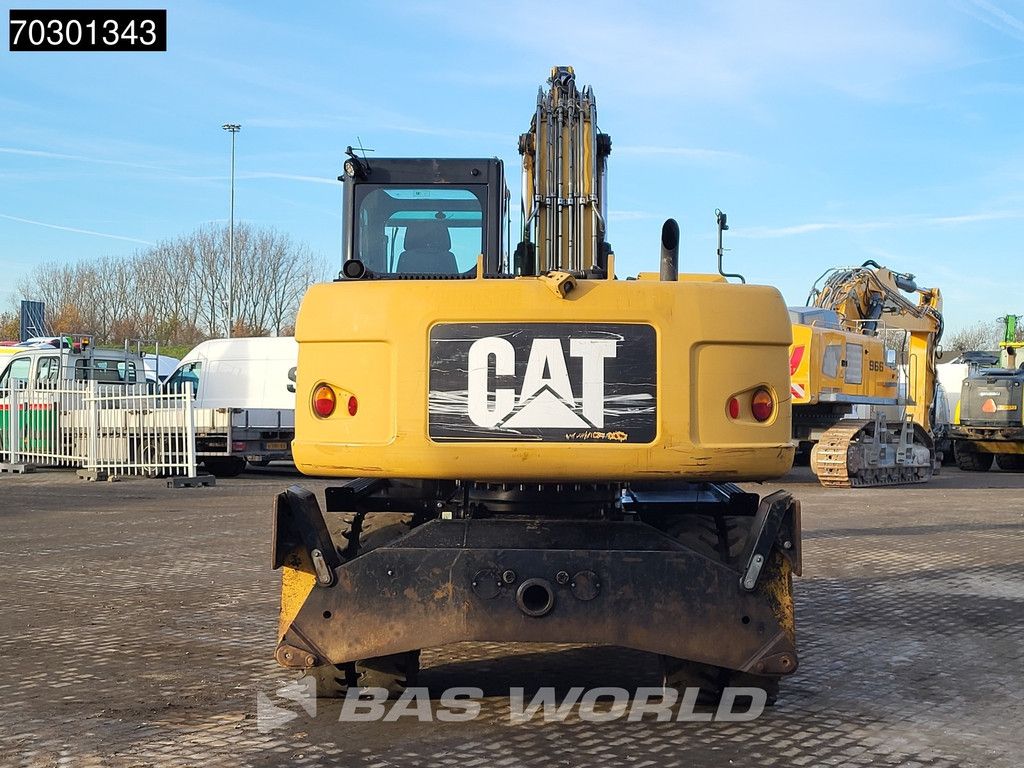 Caterpillar M315 D OUTRIGGERS + BLADE