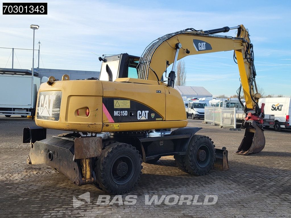 Caterpillar M315 D OUTRIGGERS + BLADE