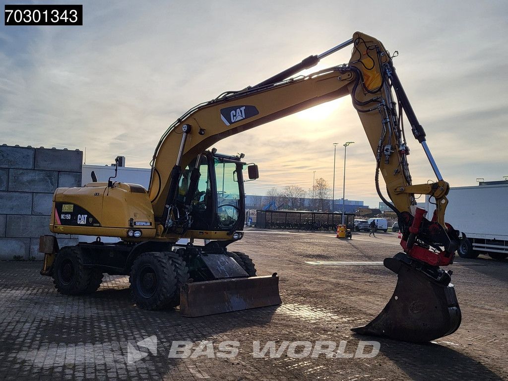 Caterpillar M315 D OUTRIGGERS + BLADE