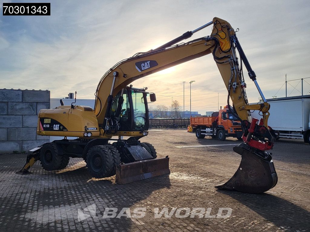 Caterpillar M315 D OUTRIGGERS + BLADE