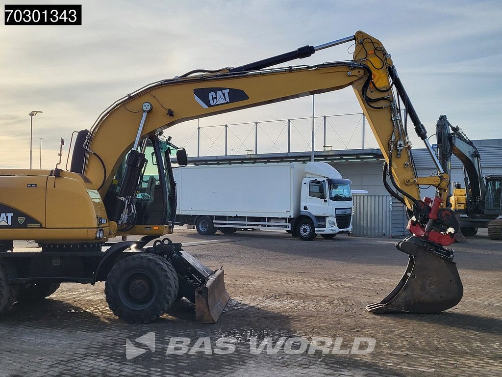 Caterpillar M315 D OUTRIGGERS + BLADE