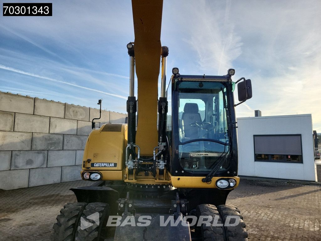 Caterpillar M315 D OUTRIGGERS + BLADE