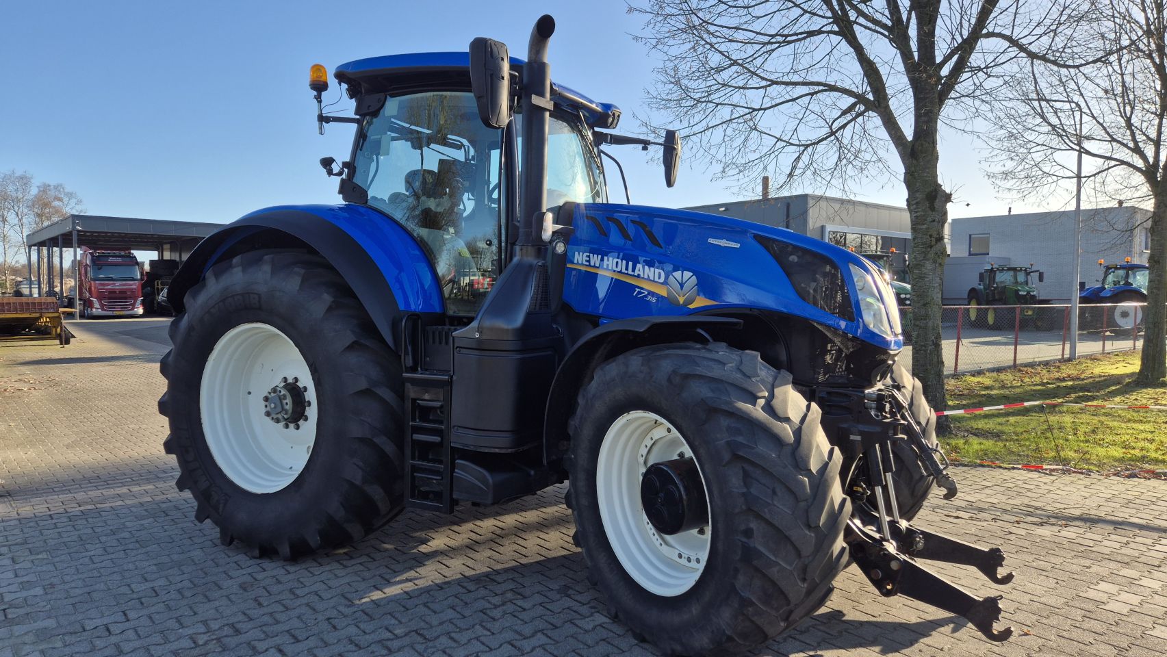 New Holland T7.315 HD AC 40Kmh. Fronthef en Lucht.