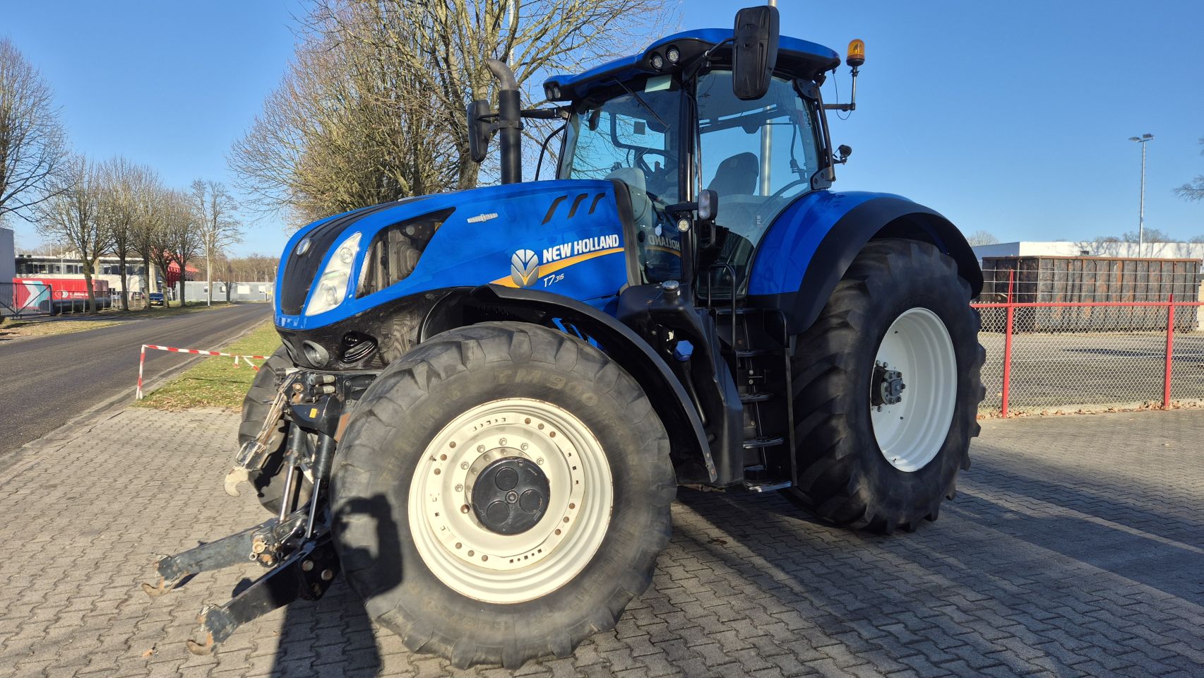 New Holland T7.315 HD AC 40Kmh. Fronthef en Lucht.