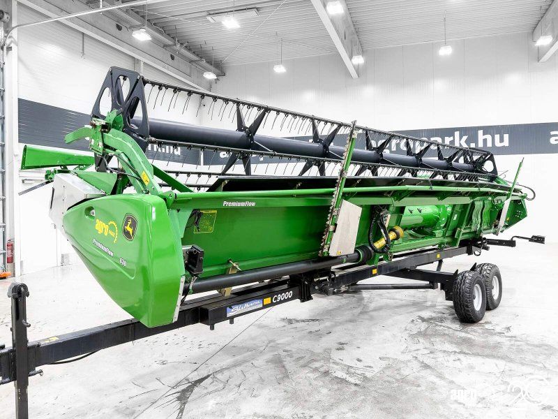 John Deere 630PF 9.15m draper header with tandem axle trailer and 2 rapesee