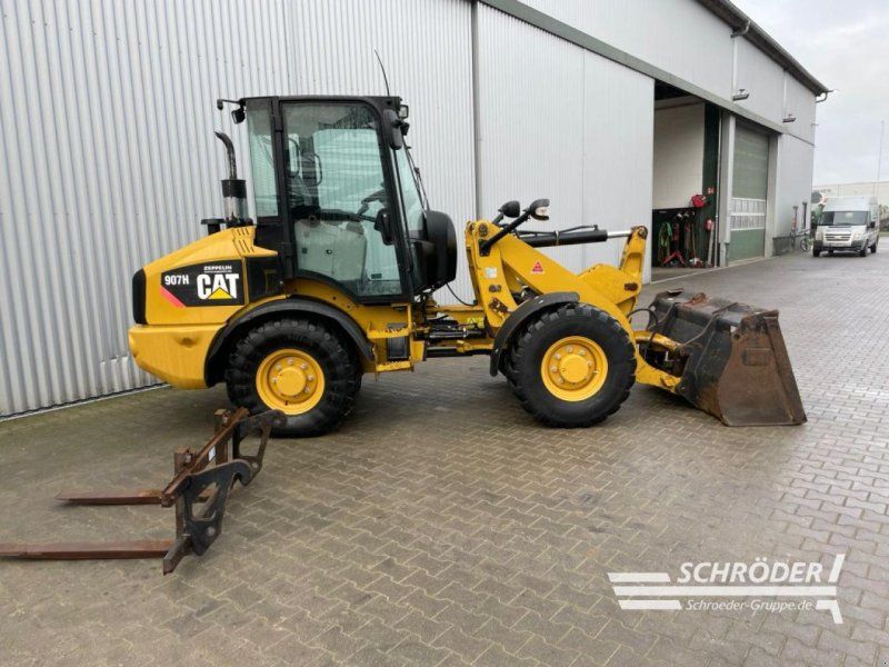 Caterpillar 907 H + SCHAUFEL + PALETTENGABEL