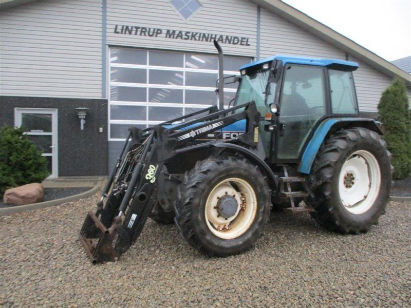 New Holland 7740 SLE Turbo Med frontlæsser og frontlift.