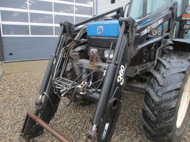 New Holland 7740 SLE Turbo Med frontlæsser og frontlift.