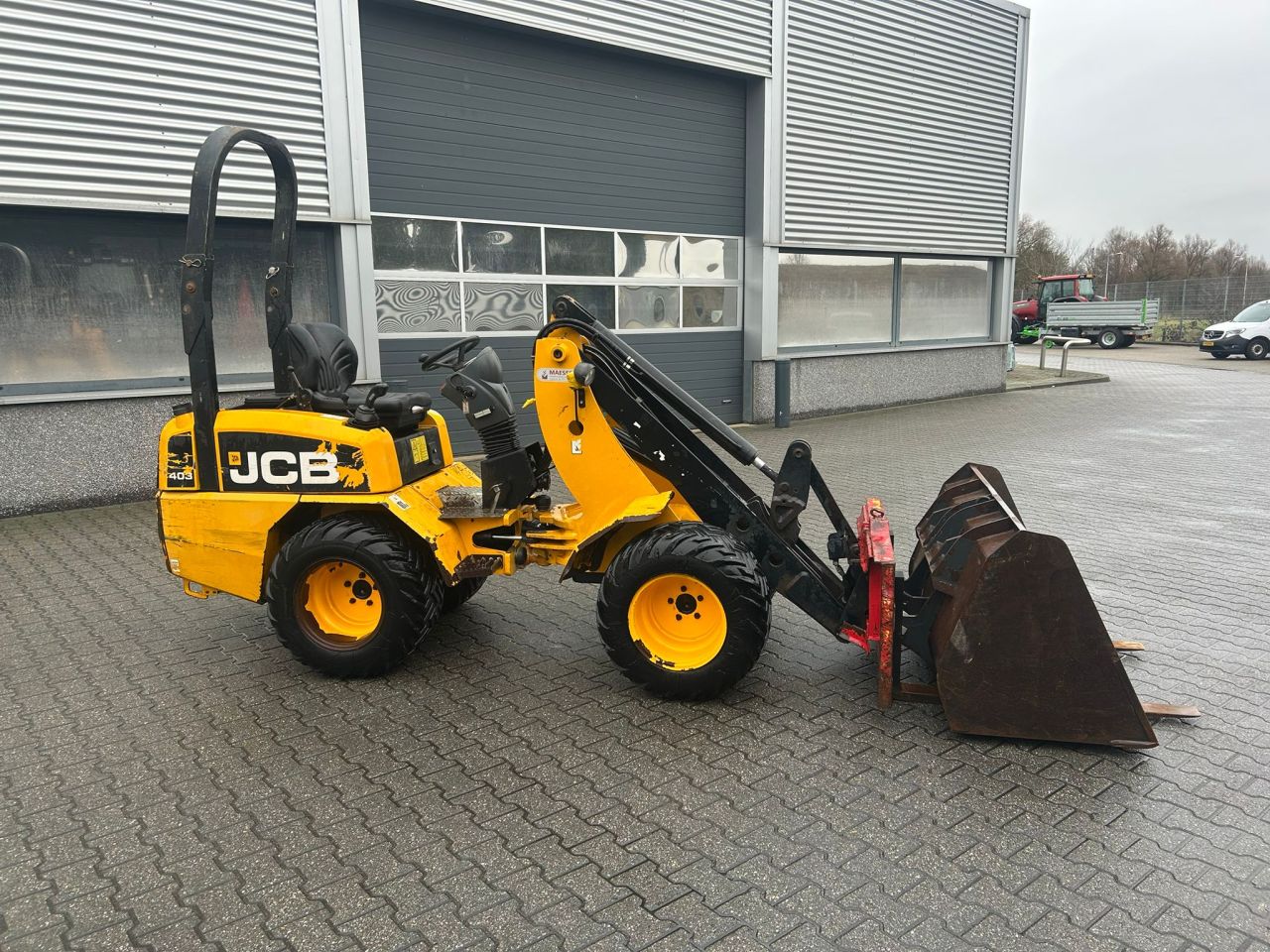 JCB 403 WLS shovel met bak en palletvork