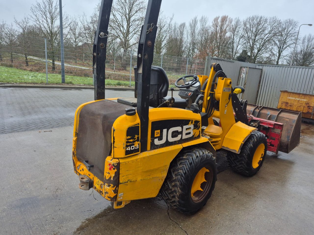 JCB 403 WLS shovel met bak en palletvork