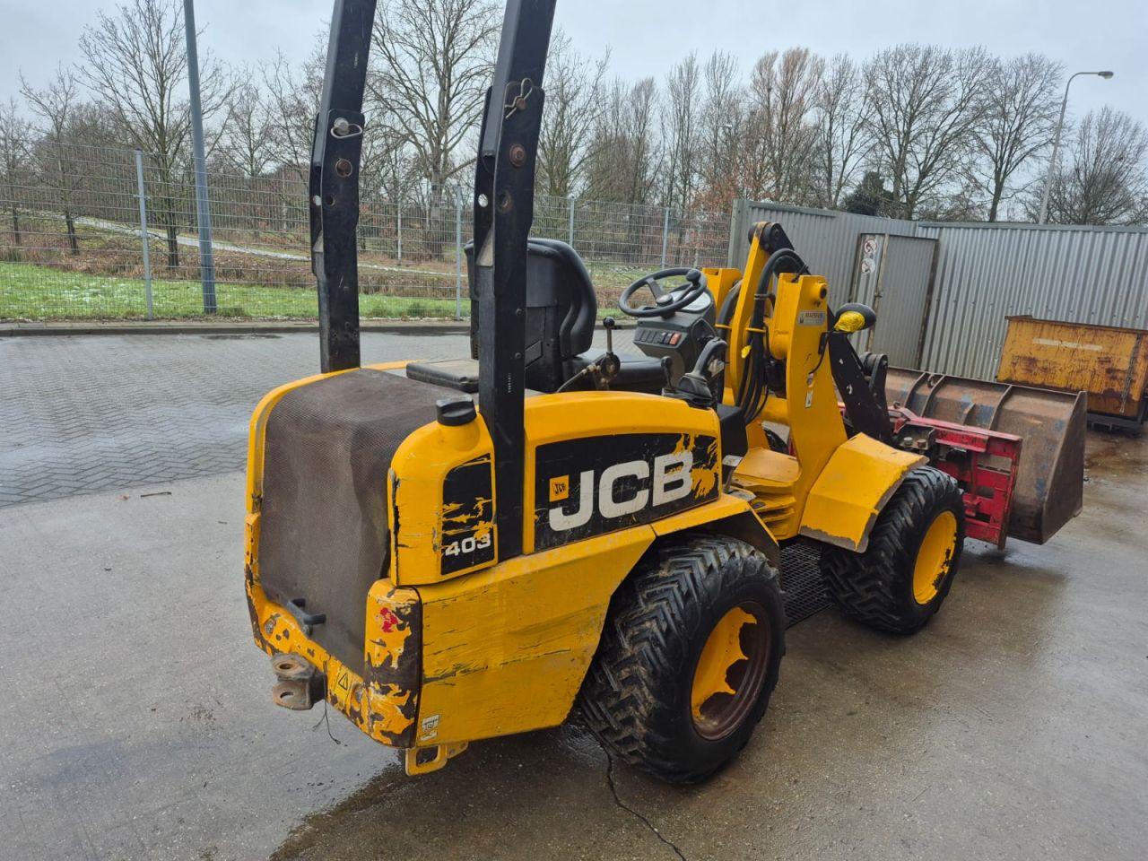 JCB 403 WLS shovel met bak en palletvork