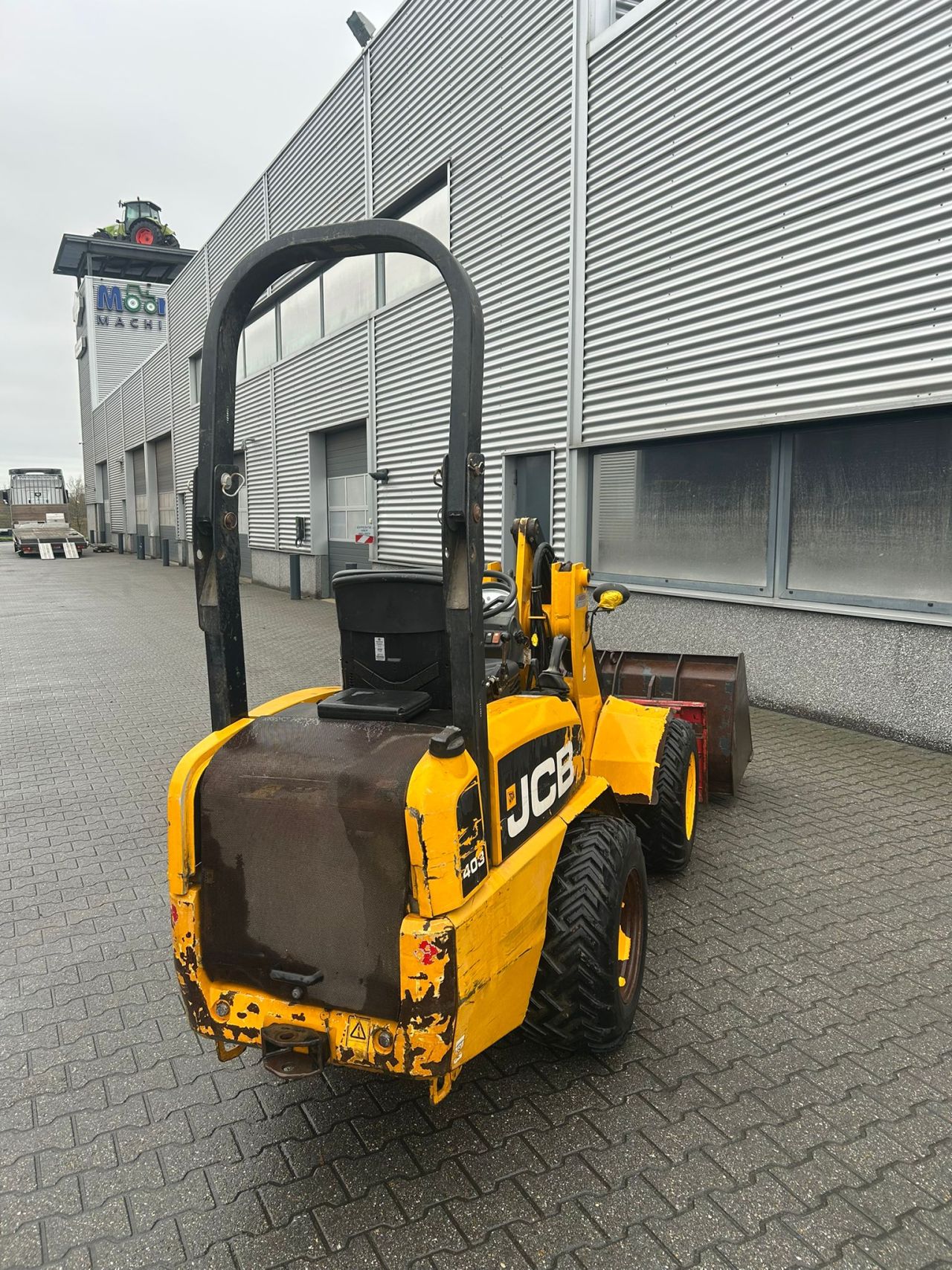 JCB 403 WLS shovel met bak en palletvork
