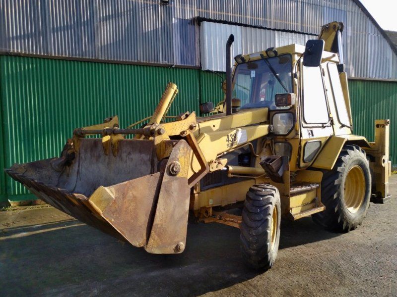 Caterpillar 438 Series II + Anbaugeräte
