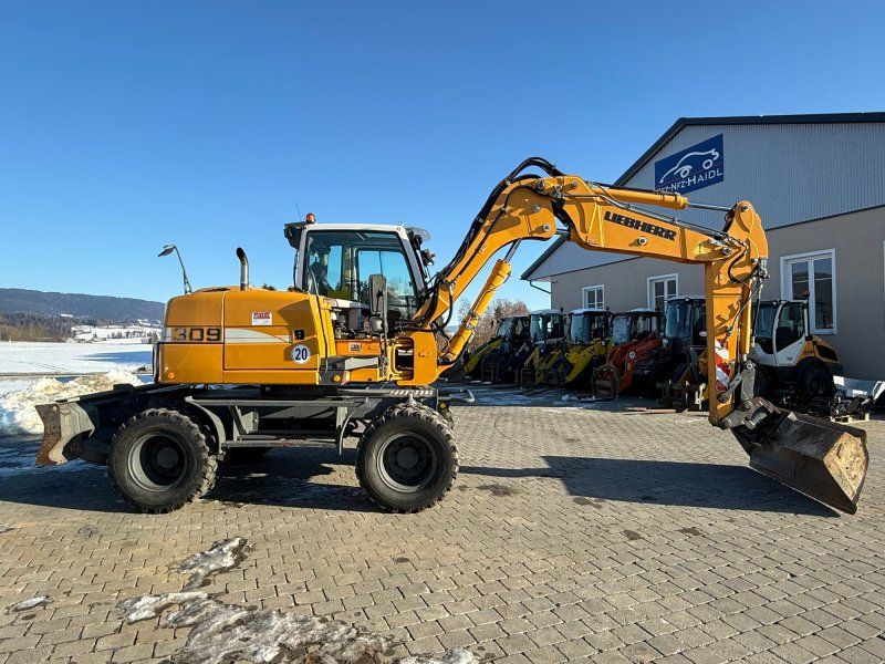 Liebherr A 309 mit Powertilt