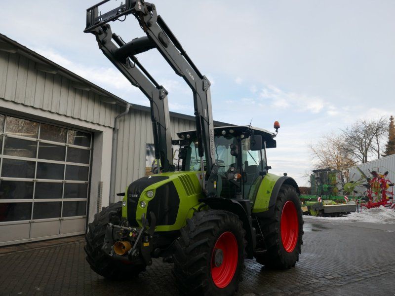 Claas Arion 650 CMATIC mit Quicke Frontlader Q66