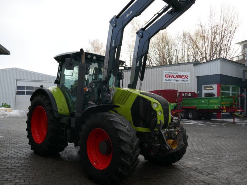 Claas Arion 650 CMATIC mit Quicke Frontlader Q66