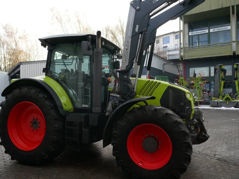 Claas Arion 650 CMATIC mit Quicke Frontlader Q66