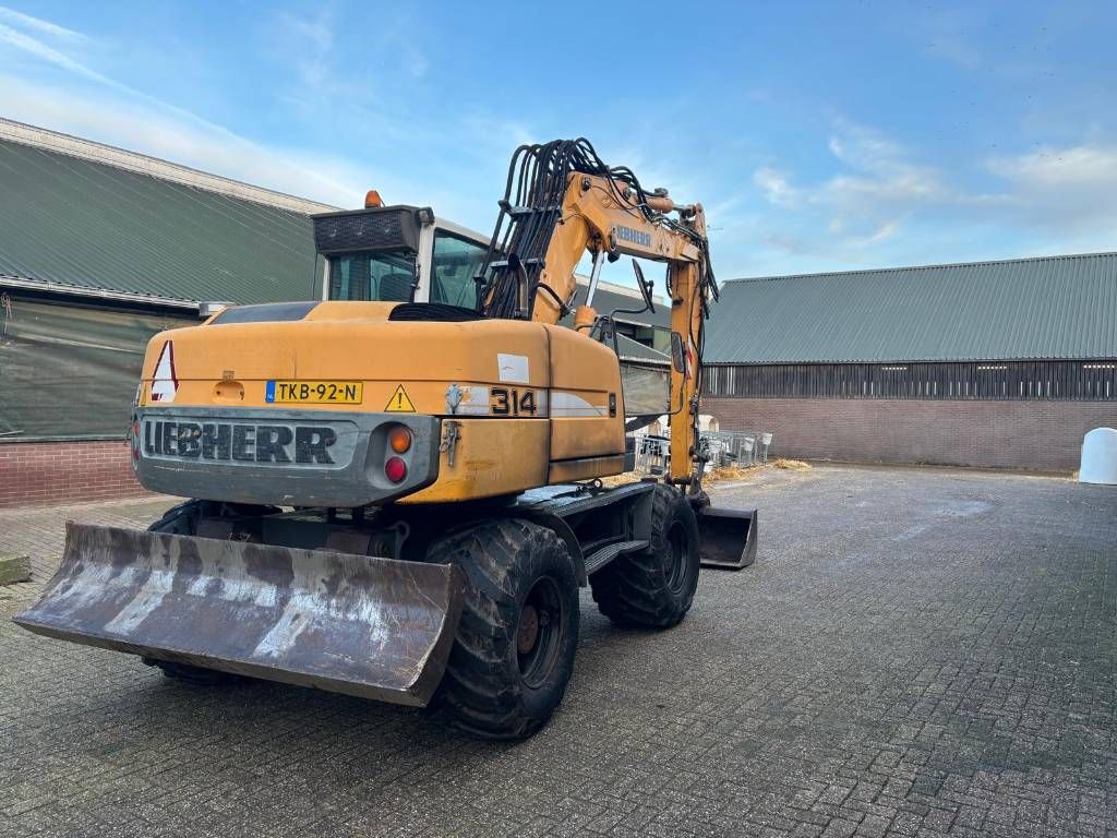 Liebherr 314 mobiele kraan graafmachine met aanbouwdelen