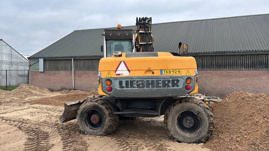 Liebherr 314 mobiele kraan graafmachine met aanbouwdelen