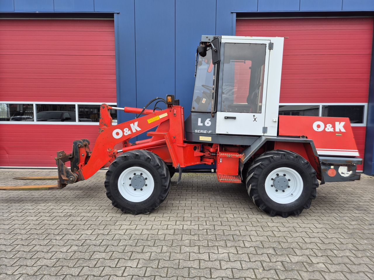 O&K L6 SHOVEL PALLETVORKEN, REDROCK KUILHAPPER EN KENTEKEN