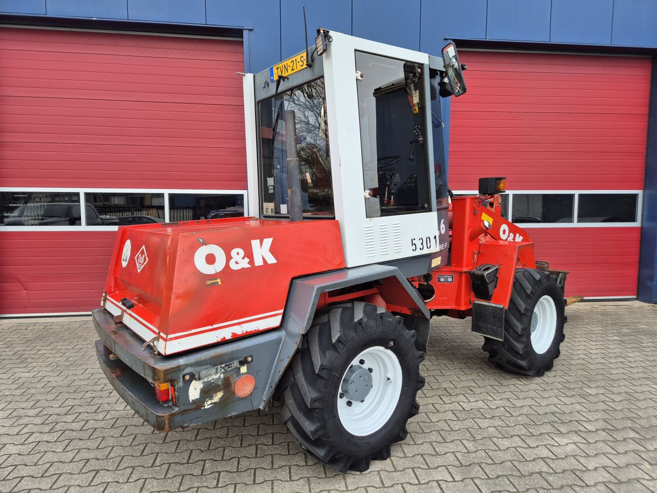 O&K L6 SHOVEL PALLETVORKEN, REDROCK KUILHAPPER EN KENTEKEN
