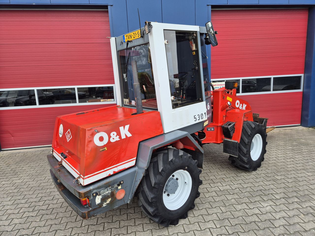 O&K L6 SHOVEL PALLETVORKEN, REDROCK KUILHAPPER EN KENTEKEN