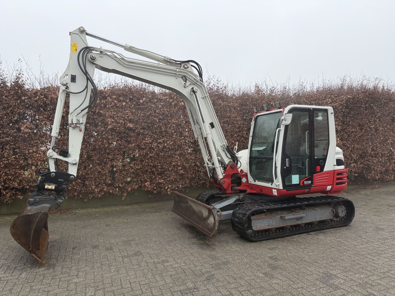 Takeuchi TB290 met diverse bakken