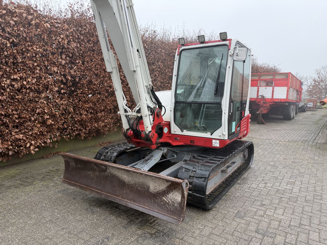 Takeuchi TB290 met diverse bakken