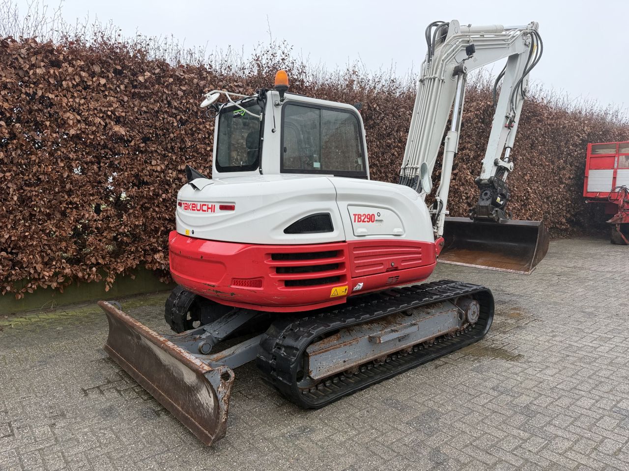 Takeuchi TB290 met diverse bakken
