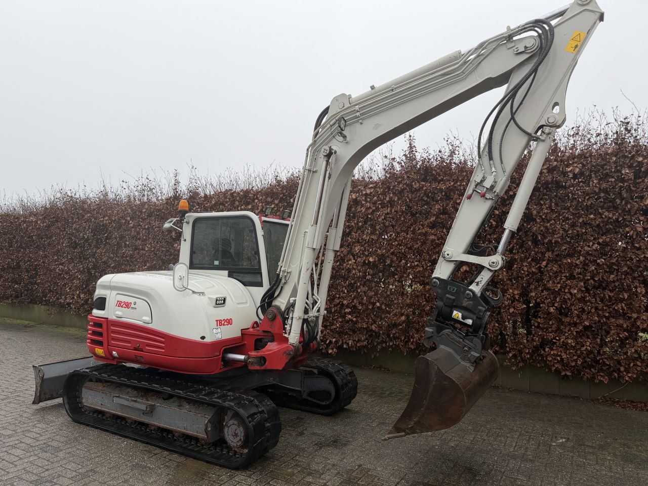 Takeuchi TB290 met diverse bakken
